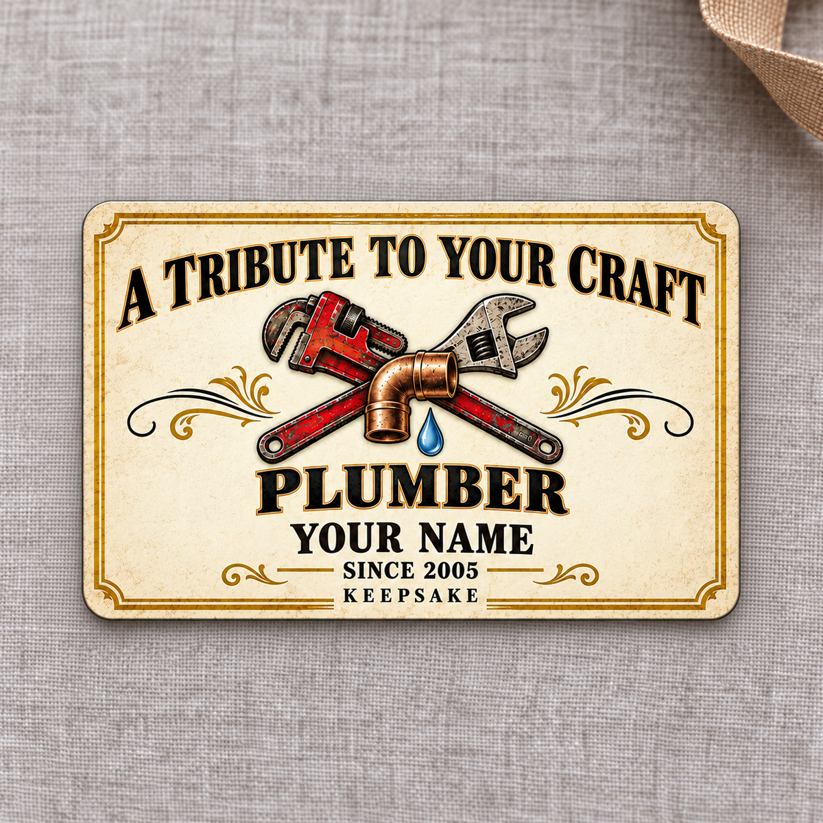 Plumber Ivory Heritage Tribute aluminum wallet card, front design on gray linen.