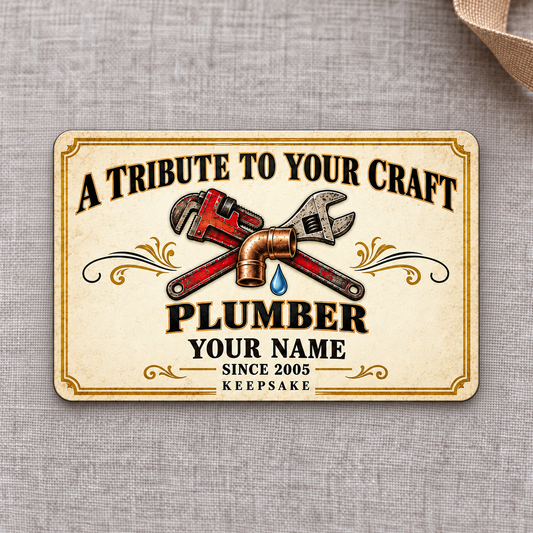 Plumber Ivory Heritage Tribute aluminum wallet card, front design on gray linen.