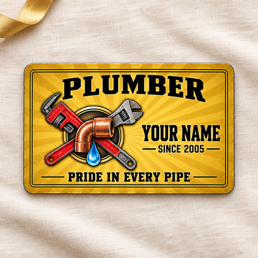 Plumber Golden Milestone aluminum wallet card, front design on cream linen.