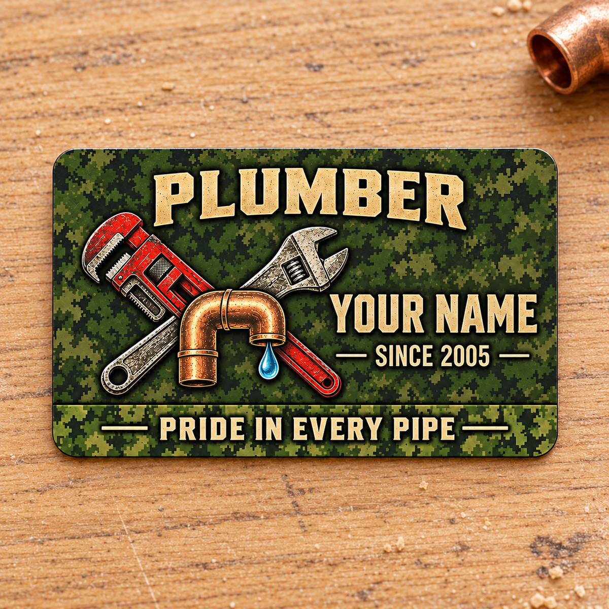 Plumber Rugged Field Pride aluminum wallet card, front design on warm oak.