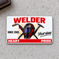 Welder Signature Classic aluminum wallet card front on pale gray concrete