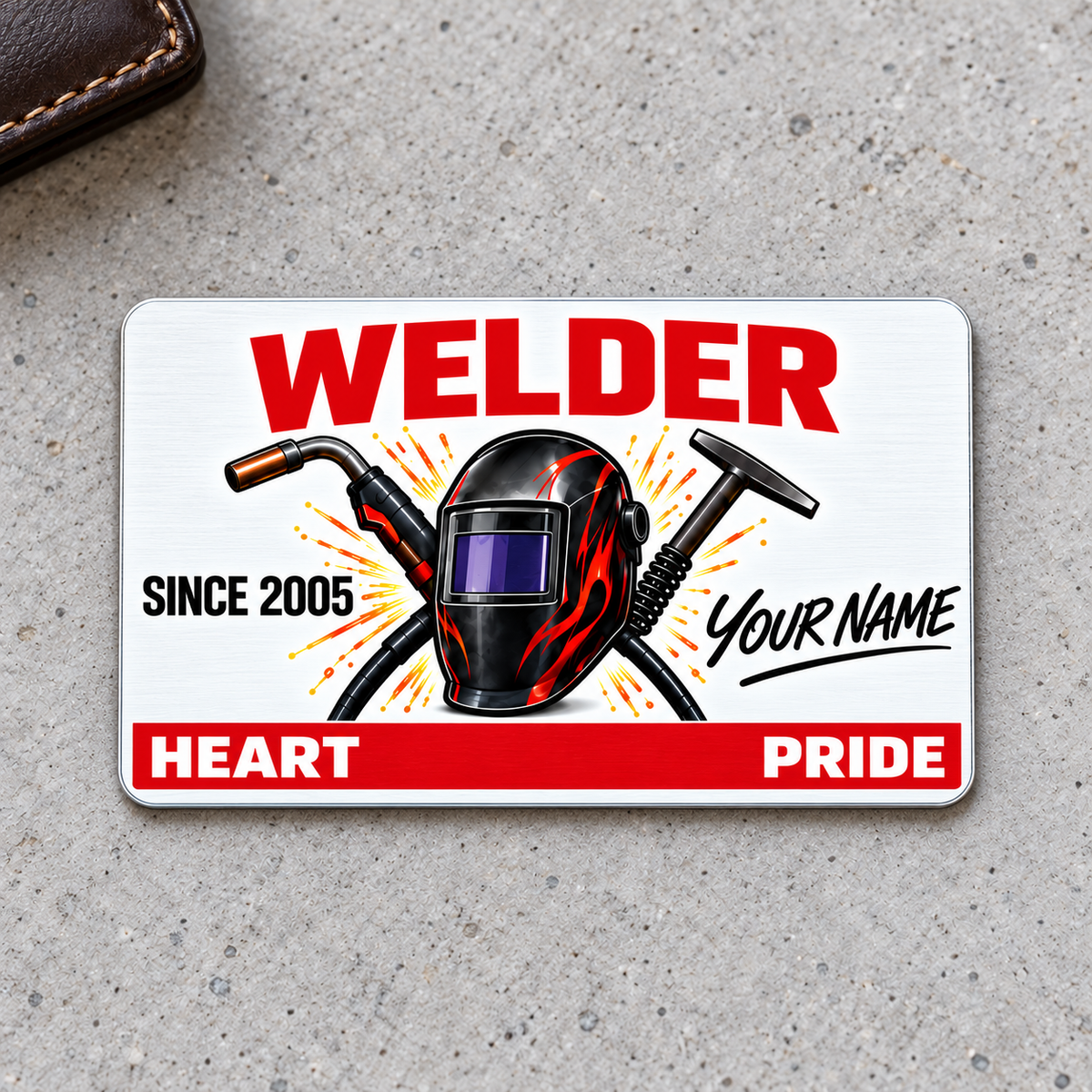 Welder Signature Classic aluminum wallet card front on pale gray concrete