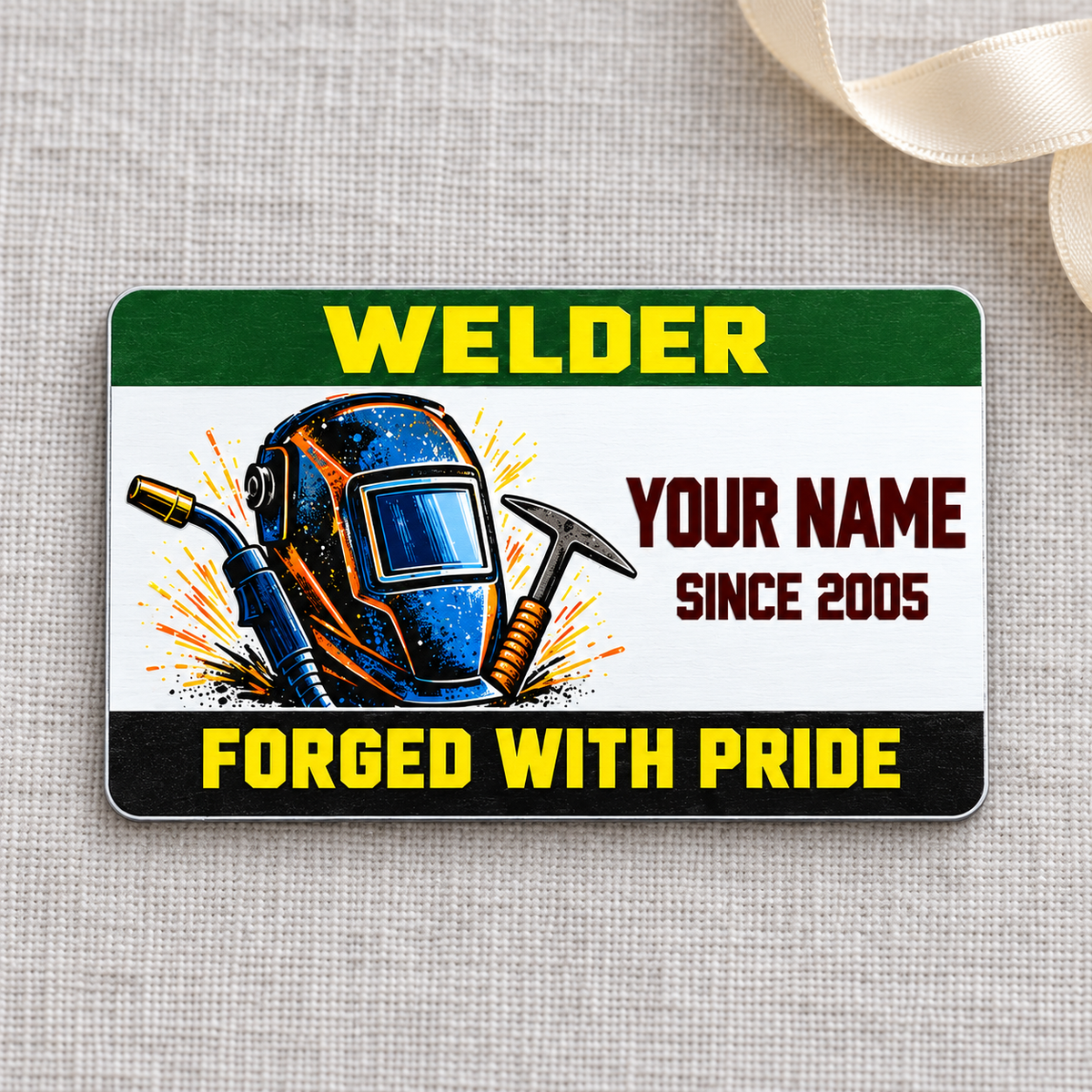Welder Green Band aluminum wallet card front on gray linen with cream ribbon