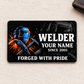 Welder Midnight Pride aluminum wallet card front on cream woven fabric