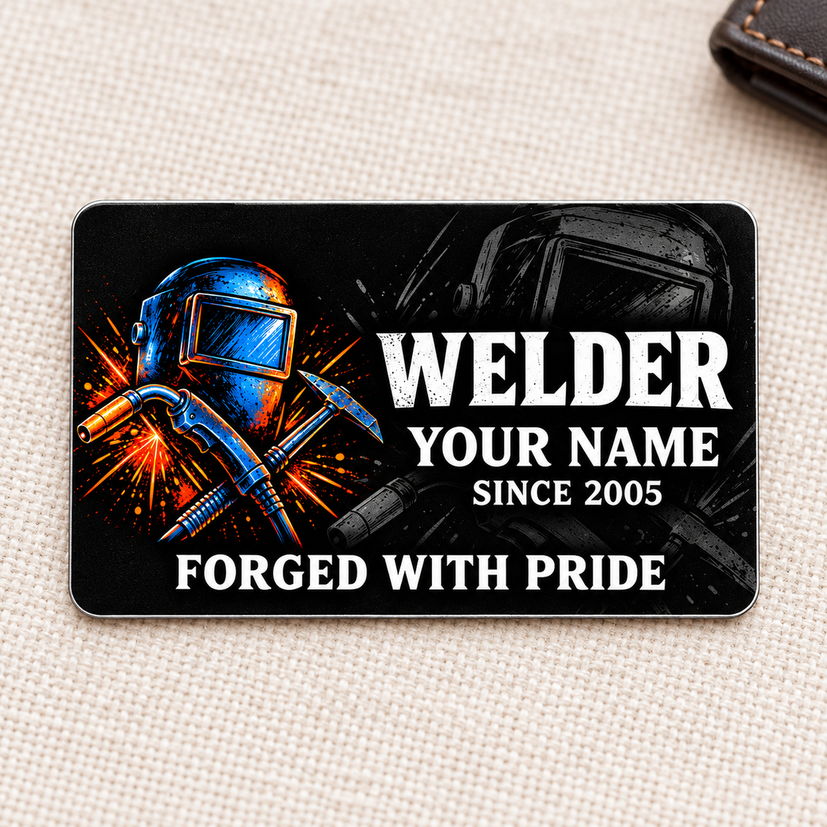 Welder Midnight Pride aluminum wallet card front on cream woven fabric