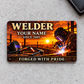 Welder Sunset Workday aluminum wallet card front on pale gray concrete
