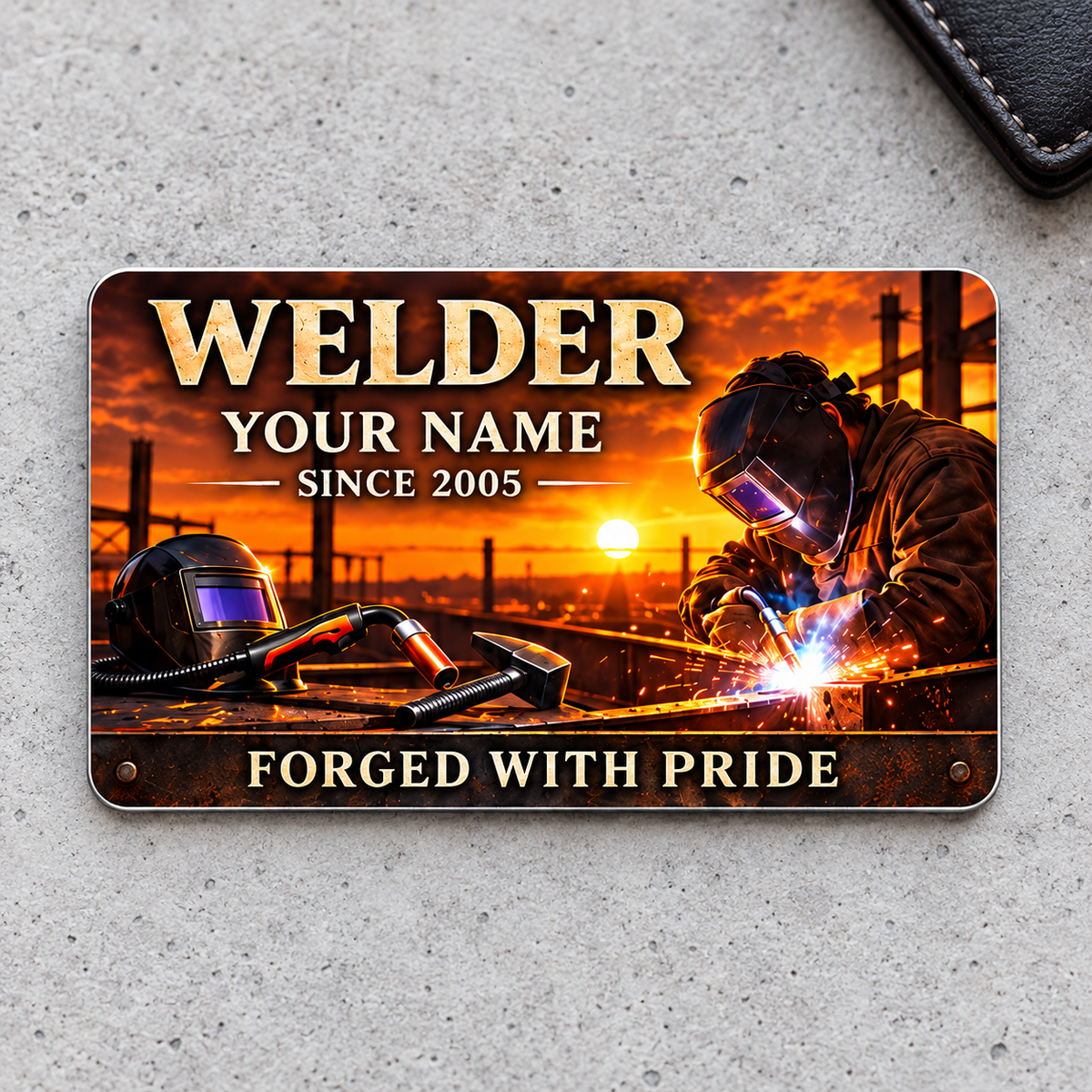 Welder Sunset Workday aluminum wallet card front on pale gray concrete
