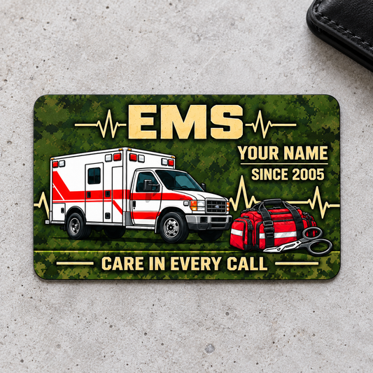 EMS Rugged Field aluminum wallet card, single front with olive camouflage and ambulance artwork on light gray concrete.