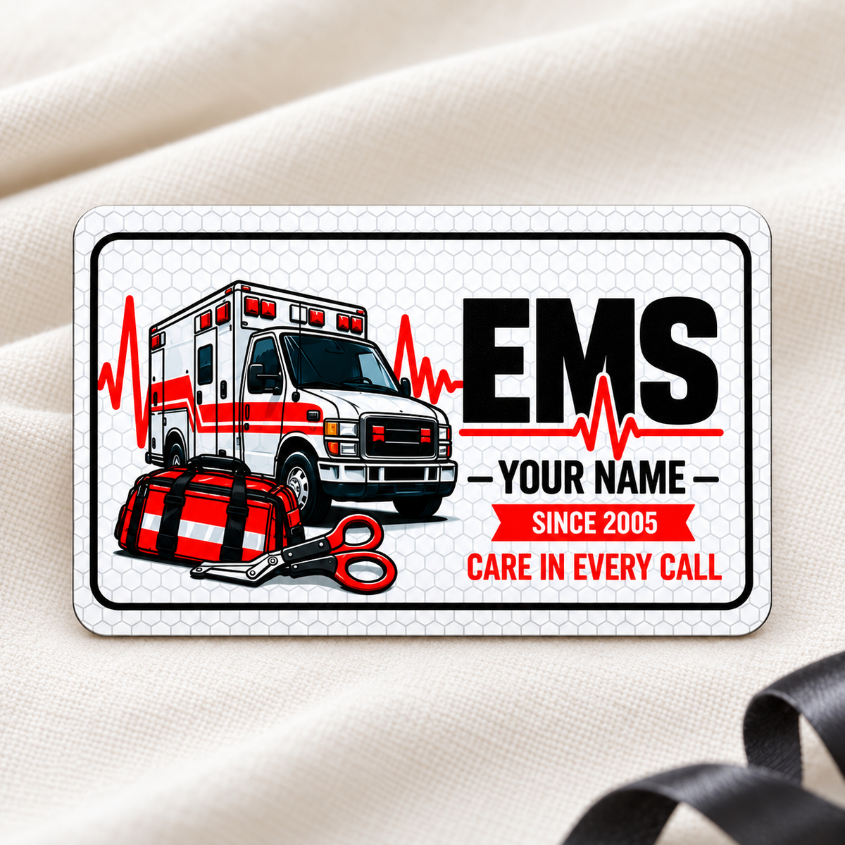 EMS Honeycomb Pride aluminum wallet card, single front with ambulance and response tools on cream fabric.