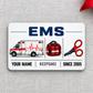 EMS Minimal Tool Grid aluminum wallet card, single front with ambulance, medical bag and shears on pale gray linen.