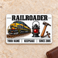 Railroader Minimal Tool Grid aluminum wallet card, front face on cream stone beside a brown wallet.