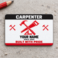 Front of the Carpenter Red Monochrome Craft aluminum wallet card on pale gray concrete.
