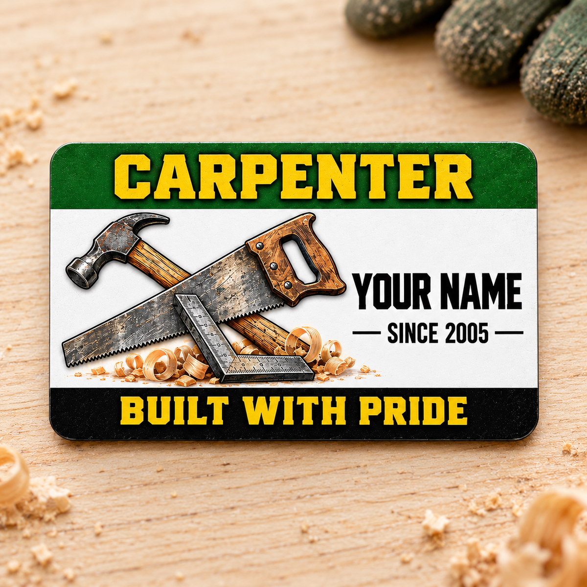 Front of the Carpenter Green Band aluminum wallet card on a light wooden work surface.