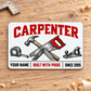 Front of the Carpenter Minimal Tool Grid aluminum wallet card on light oak.