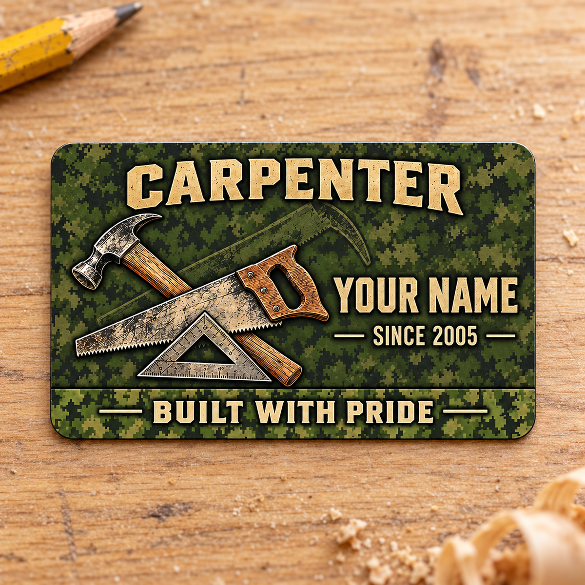 Front of the Carpenter Rugged Field Pride aluminum wallet card on a light oak workbench.