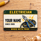 Electrician Heritage Band aluminum wallet card, single front view on pale wood