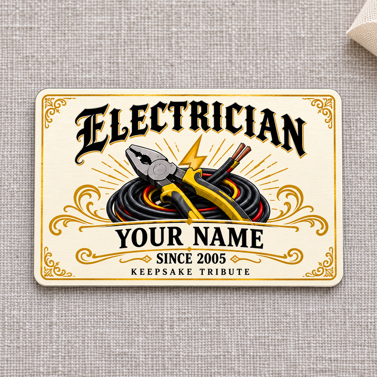 Electrician Ivory Heritage aluminum wallet card, front view on gray linen