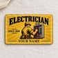 Electrician Golden Milestone aluminum wallet card, front view on cream linen