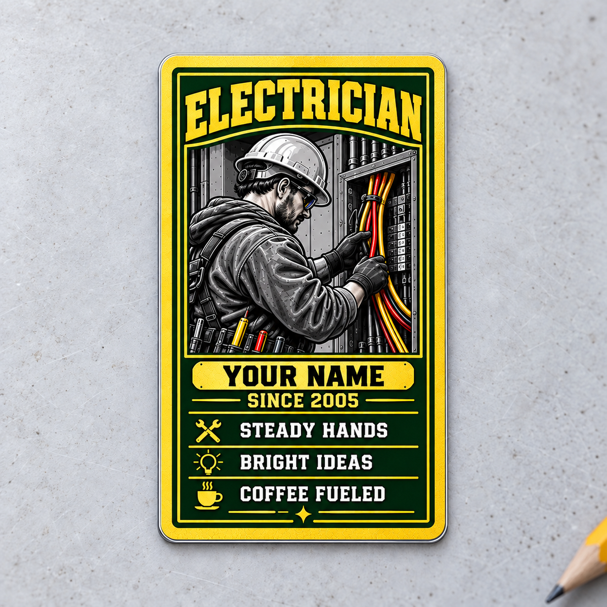 Electrician Trade Legend aluminum wallet card, portrait front view on light gray concrete