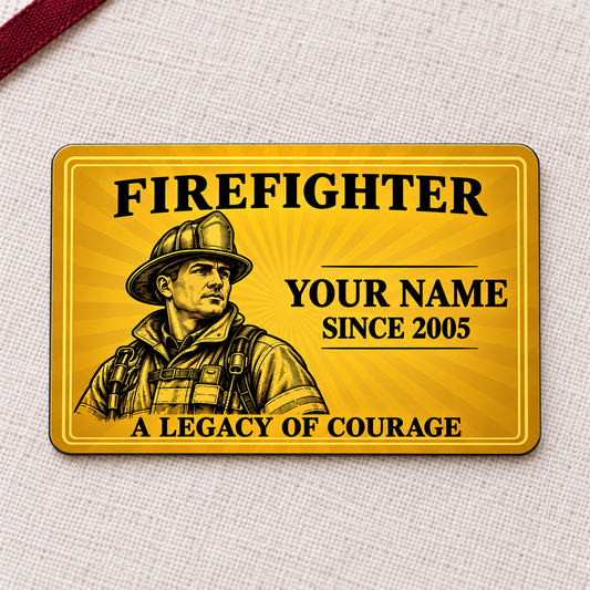Golden firefighter aluminum wallet card with engraved firefighter artwork on cream linen.
