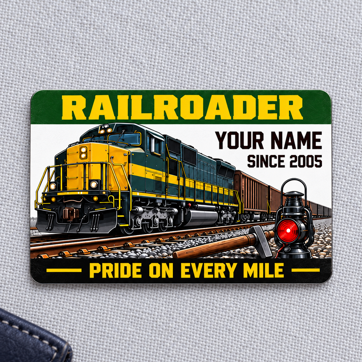 Railroader Green Band aluminum wallet card front centered on pale gray fabric.