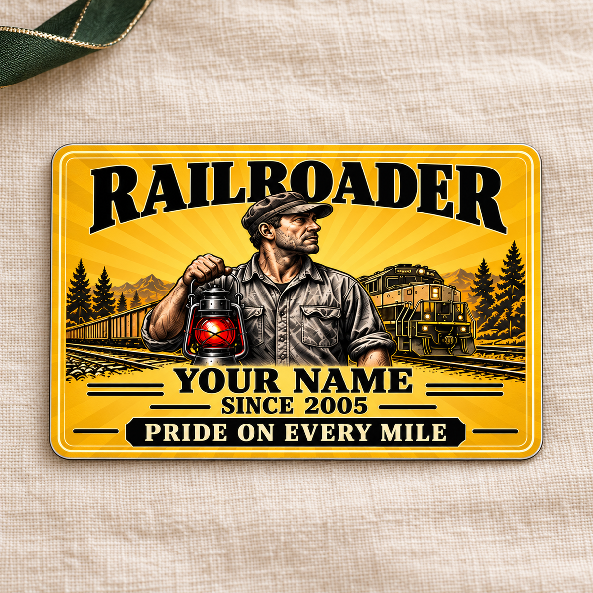 Railroader Golden Milestone aluminum wallet card front on cream linen.