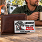 Arborist wallet card in a arborist tree-care rest area with an adult man and leather wallet.