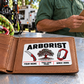 Arborist wallet card in a arborist tree-care rest area with an adult man and leather wallet.