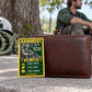 Arborist wallet card in an arborist tree-care rest area with an adult man and leather wallet.