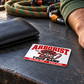 Arborist wallet card in an arborist tree-care rest area with an adult man and leather wallet.