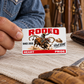 Adult rider holding the Bull Riding/Rodeo Signature Classic wallet card over a linen-covered table