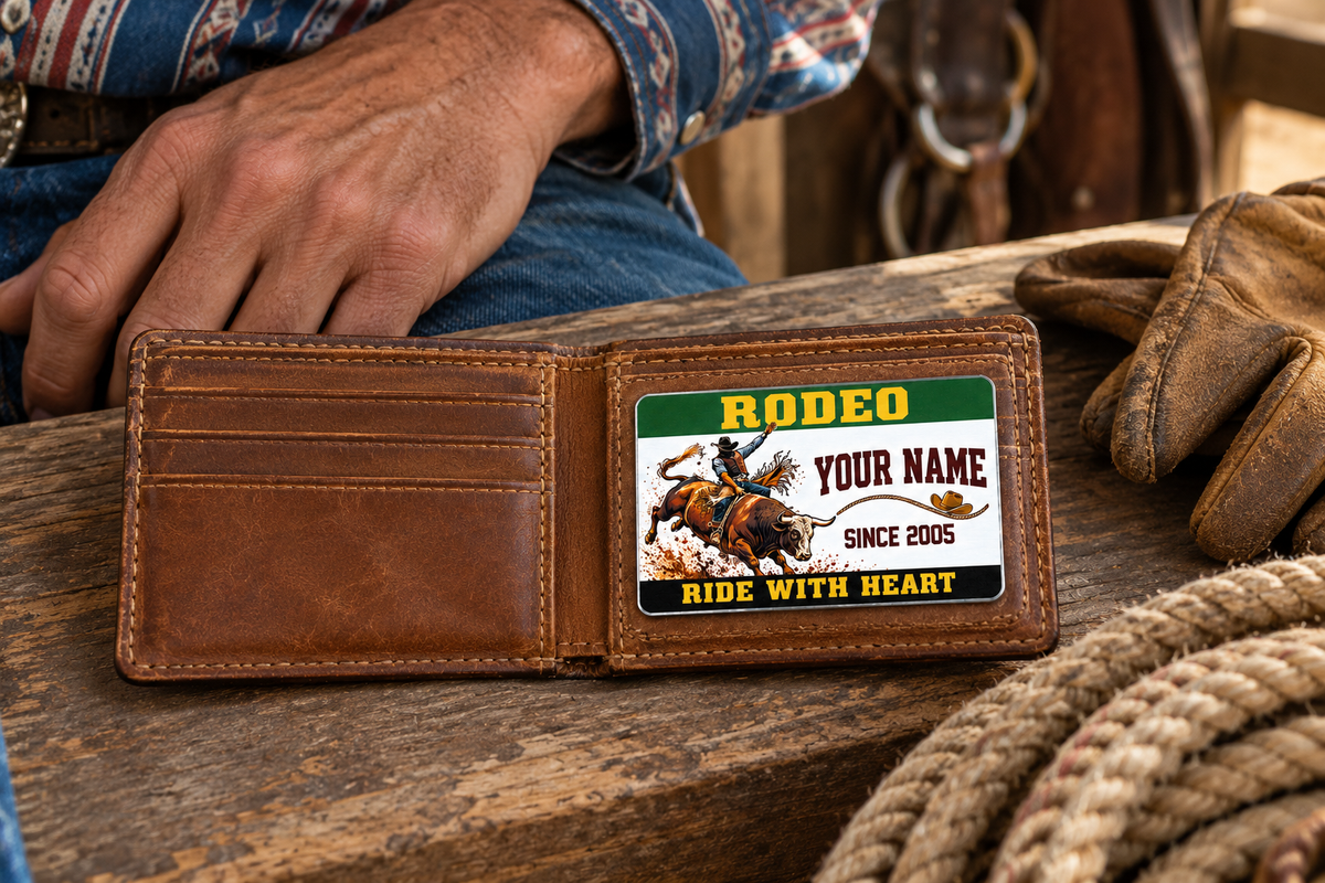 Bull Riding/Rodeo Green Band aluminum wallet card resting within one panel of an open tan wallet