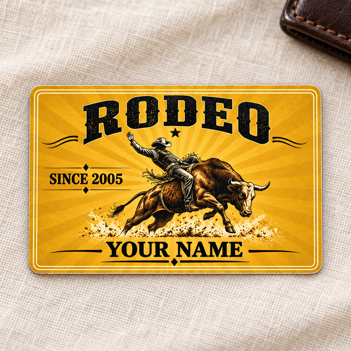 Bull Riding Rodeo Golden Milestone aluminum wallet card front on cream linen