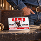 Bull Riding/Rodeo Signature Modern aluminum wallet card leaning against a closed wallet on a tack-room ledge