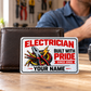Electrician Honeycomb Pride aluminum wallet card leaning against a closed wallet during a coffee break