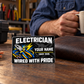 Electrician Midnight Pride wallet card beside a worn brown wallet during a coffee break