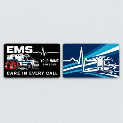 EMS Midnight Pride aluminum keepsake wallet card, front and reverse views. White EMS lettering, an ambulance and response tools contrast with a black front, while the reverse features bold blue-and-teal ambulance graphics.