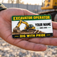 The printed front of the Excavator Operator Green Band aluminum wallet card shown in an occupational lifestyle setting with an adult worker.