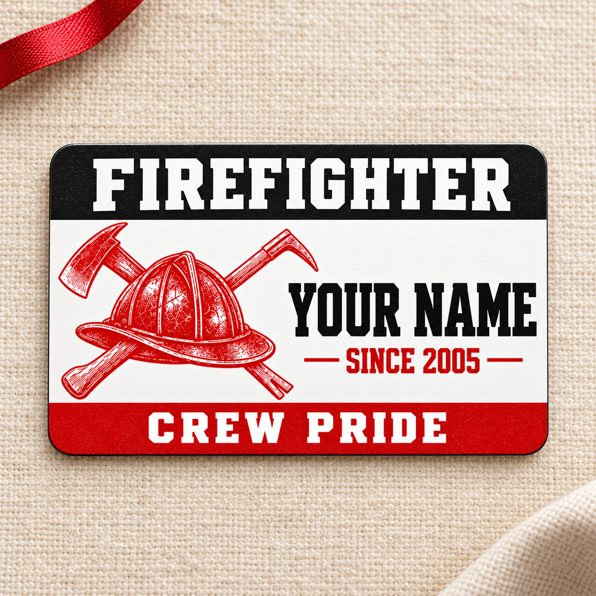Firefighter red monochrome aluminum wallet card front on cream fabric.