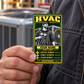 HVAC Trade Legend portrait aluminum keepsake wallet card held by an adult technician near a charcoal work jacket, with condenser equipment softly visible behind.