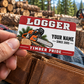 Logger wallet card in a forest logging rest area with an adult man and leather wallet.