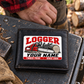 Logger wallet card in a forest logging rest area with an adult man and leather wallet.