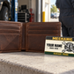 Mechanic Heritage Band aluminum wallet card shown at wallet scale in an automotive workshop setting.