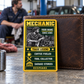 Mechanic wallet card in a automotive repair garage break area with an adult man and leather wallet.