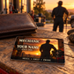 Mechanic Sunset Workday aluminum wallet card shown at wallet scale in an automotive workshop setting.