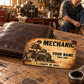 Mechanic Sepia Legacy aluminum wallet card shown at wallet scale in an automotive workshop setting.