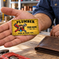 The printed front of the Plumber Golden Milestone aluminum wallet card shown in an occupational lifestyle setting with an adult worker.