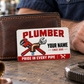 The printed front of the Plumber Signature Modern aluminum wallet card shown in an occupational lifestyle setting with an adult worker.