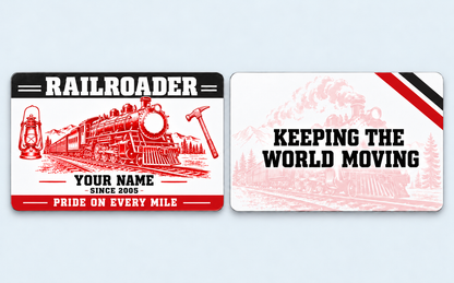 Railroader Red Monochrome aluminum keepsake wallet card, front and reverse views. Bold red locomotive, lantern and track-hammer artwork pairs with a black header and red footer. A pale train illustration and a railroad-pride message complete the reverse.