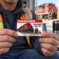 Railroader Red Header wallet card held by an adult worker seated in a safe depot break area.